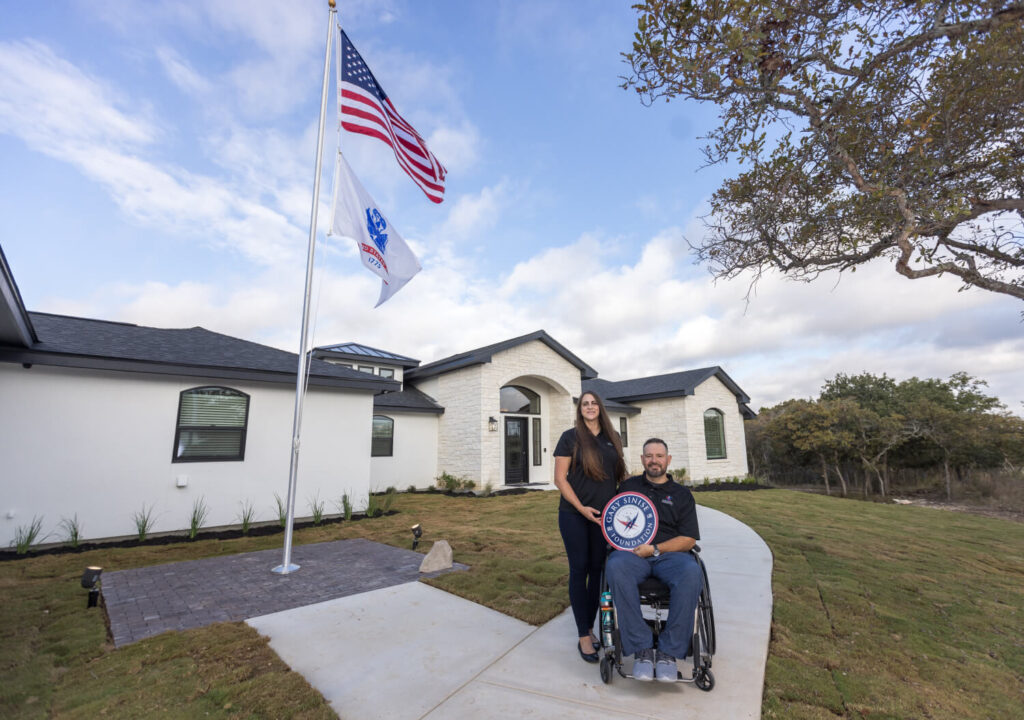 Retired U.S. Army Staff Sergeant (SSG) Jason Tabansky and wife outside their newly built smart home.